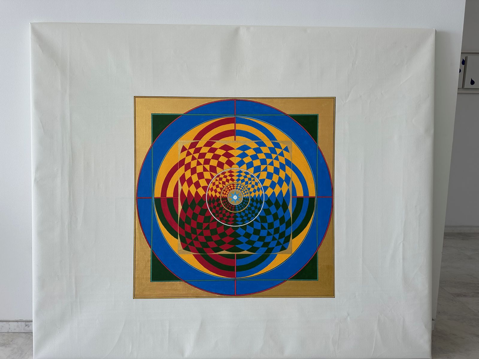 The small central motif on the large empty canvas