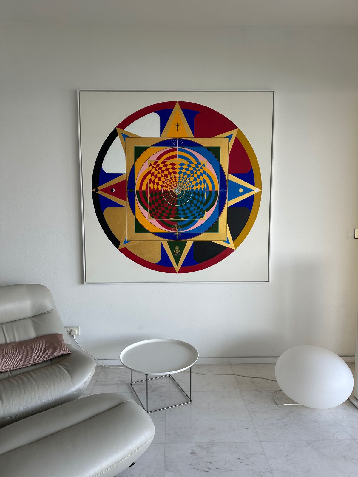 The framed painting hung on the wall